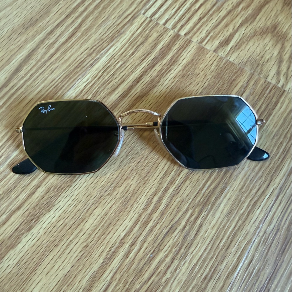 Ray-Ban Gold Frame Sunglasses with Black Lenses and Geometric Shape